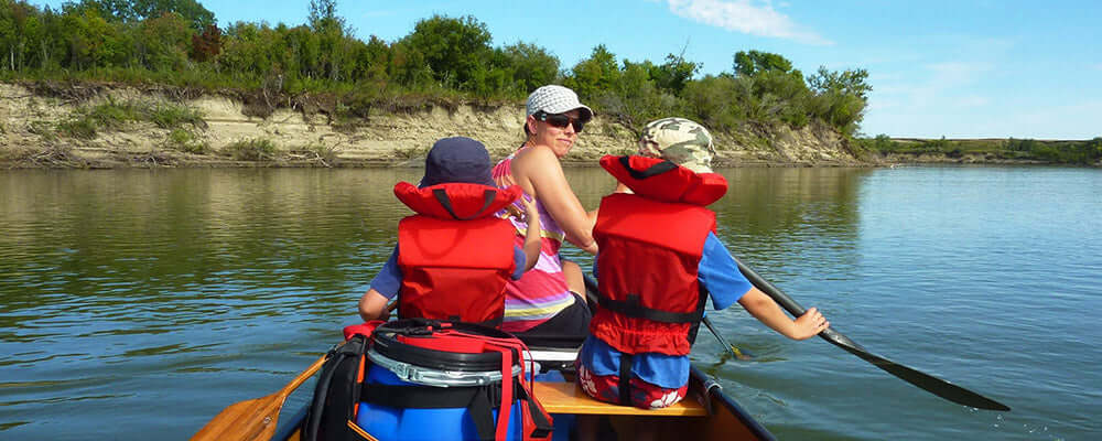 people paddling on a river