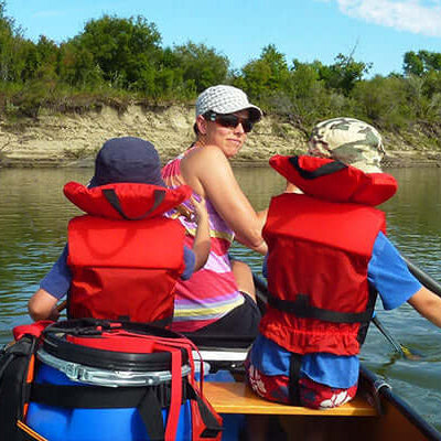 people paddling on a river