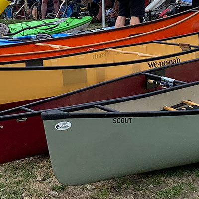 canoes lined up on the grass
