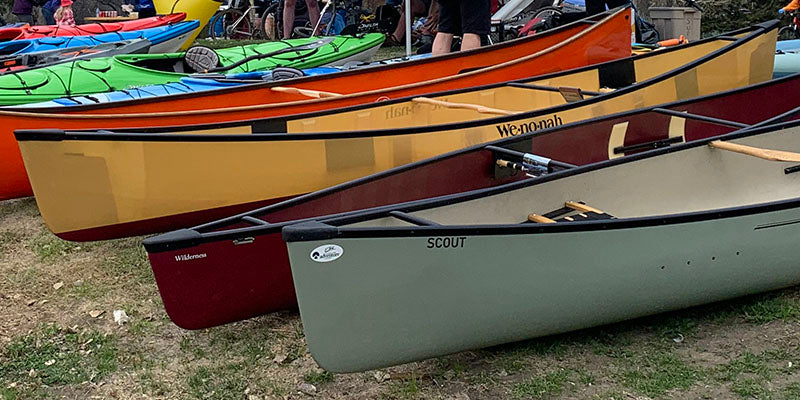 canoes lined up on the grass