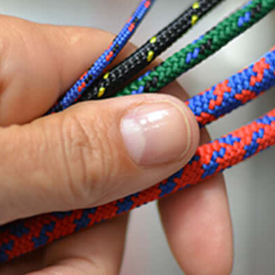 Hand holding colorful ropes, showcasing options for outdoor tasks related to The right rope for the job.