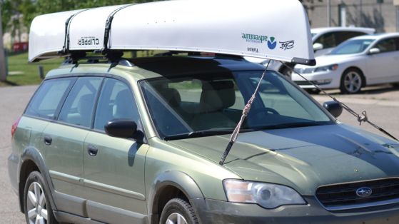 car with canoe on top