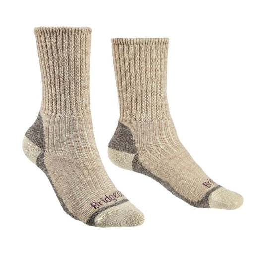 Pair of beige socks with dark gray accents on a white background