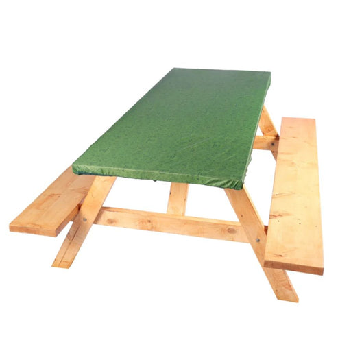 A wooden picnic table with a green padded top cushion, isolated on a white background.