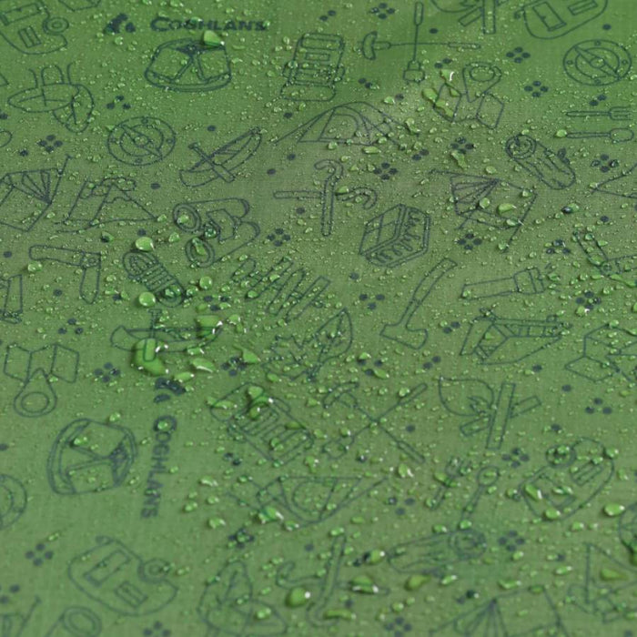 Close-up of a green textured surface with embossed outdoor-themed icons and water droplets on top. The embossed text includes Coghlans.