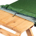A green outdoor table cover with a subtle leaf pattern, draped over a light-colored wooden picnic table against a white background.