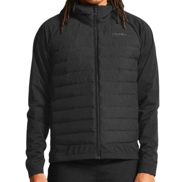 Black puffer jacket worn by a person on a white background