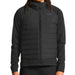 Black puffer jacket worn by a person on a white background