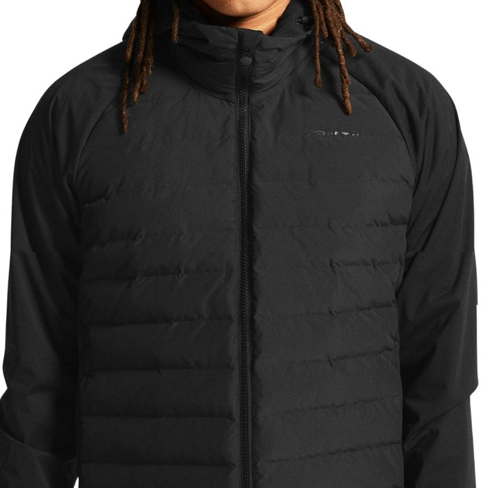 Black puffer jacket worn by a person with dreadlocks on a white background