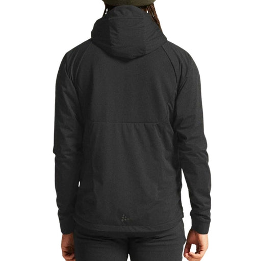 Person wearing a black sport jacket from behind on a white background