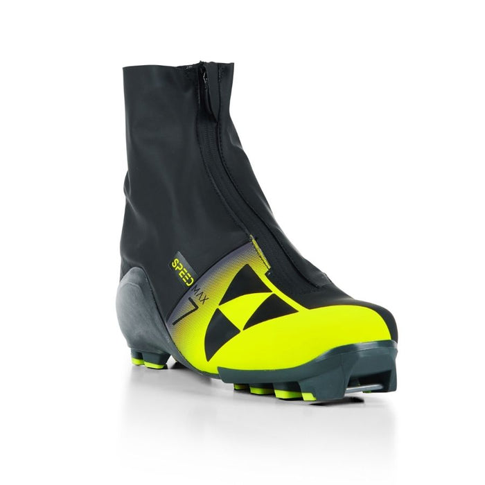 Black and yellow ski boot with Fischer branding against a white background.