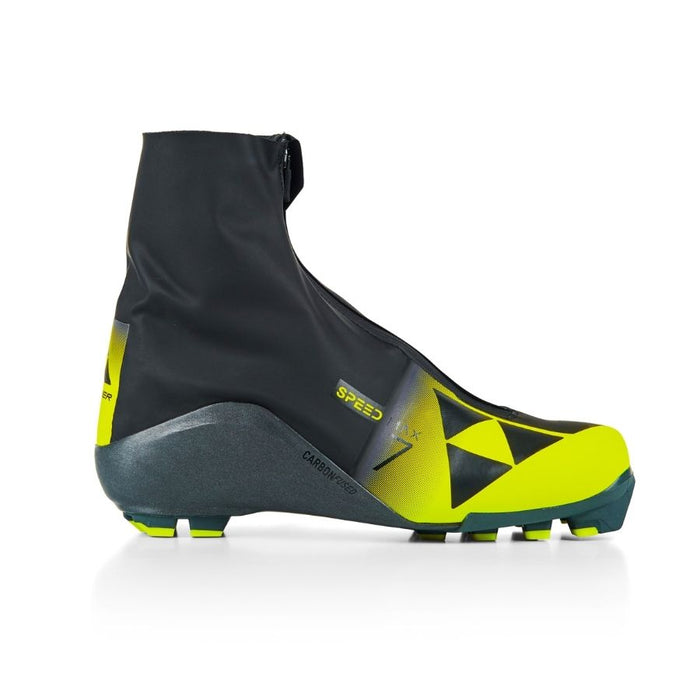 Black and yellow ski boot with Fischer branding against a white background.