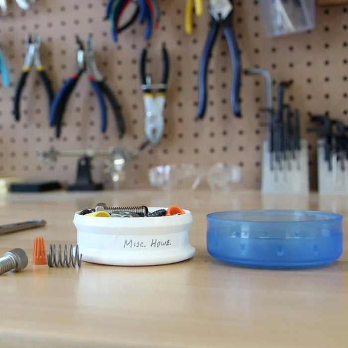 A white circular tool holder labeled 'Misc. Hous.