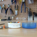 A white circular tool holder labeled 'Misc. Hous.