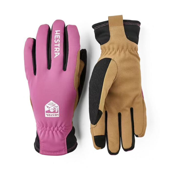 Pink and tan gloves with Hestra logo on a white background