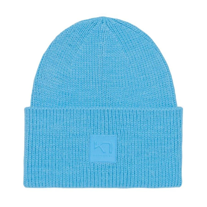 A light blue ribbed knit beanie hat with a folded cuff and a small tonal square logo patch on the front, shown against a plain white background.