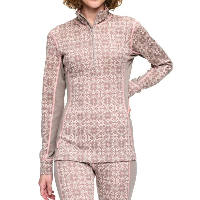 A woman wearing a long-sleeve quarter-zip athletic top and matching leggings in a dusty pink and beige Nordic pattern, shown against a plain white background.