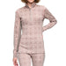 A woman wearing a long-sleeve quarter-zip athletic top and matching leggings in a dusty pink and beige Nordic pattern, shown against a plain white background.