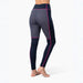 A person wearing high-waisted athletic leggings shown from the back against a clean white studio background. The leggings are dark navy with a geometric patterned panel on the upper thigh and bright pink piping accents.