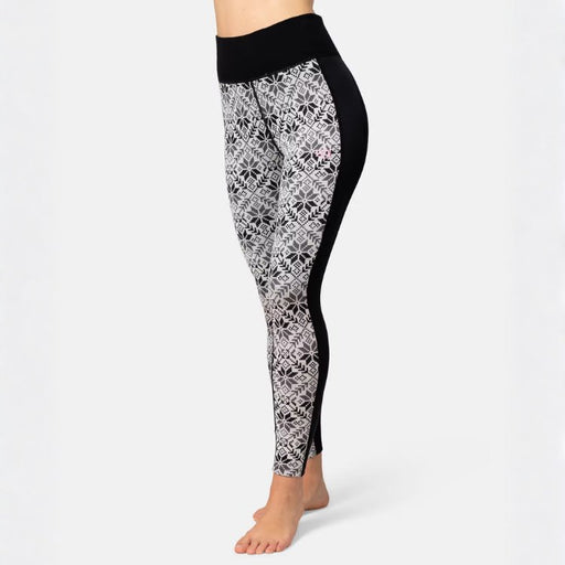 woman's legs wearing patterned black and white leggings on a white background