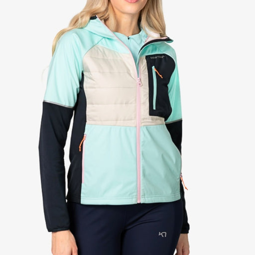 Woman wearing a colorful jacket with a white background