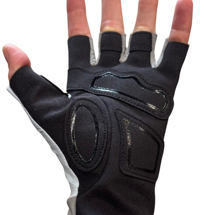 Black half-finger glove with silicone accents on a white background