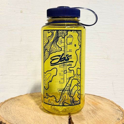 Yellow water bottle with navy blue lid and map design on a wooden surface