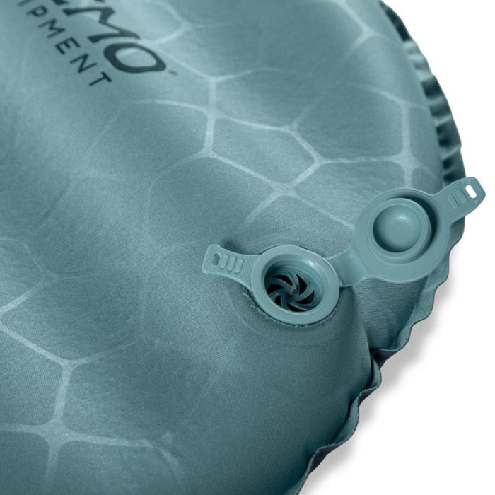 Close-up of a textured gray inflatable sleeping pad with brand name on a white background
