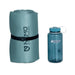 Roll-up sleeping pad with Nemo Equipment logo and a blue water bottle with Nalgene logo on a white background