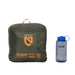 Packed sleeping bag cube beside a grey water bottle on a white background