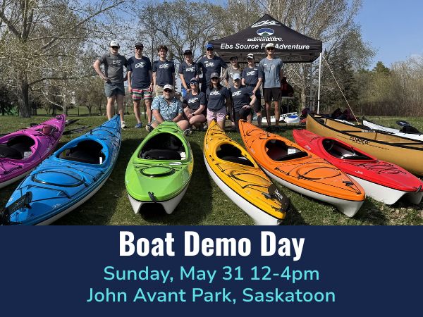 Group of people standing behind colorful kayaks with a tent in the background, promoting Boat Demo Day.