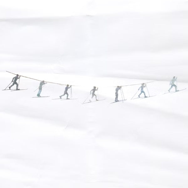 garland of skiers against a white background