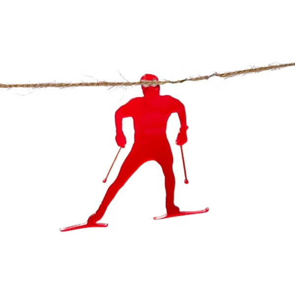Red acrylic skiing silhouette decoration on a white background