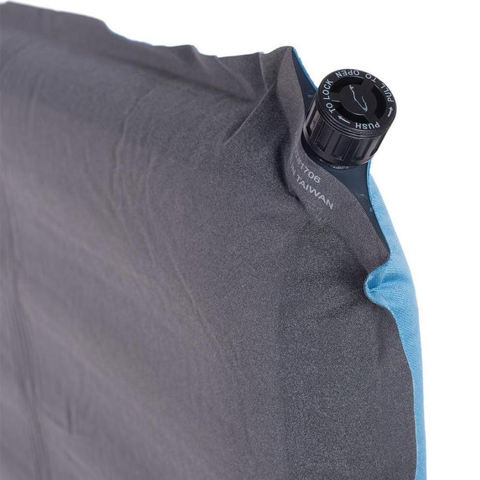 Valve on a grey sleeping pad with a white background