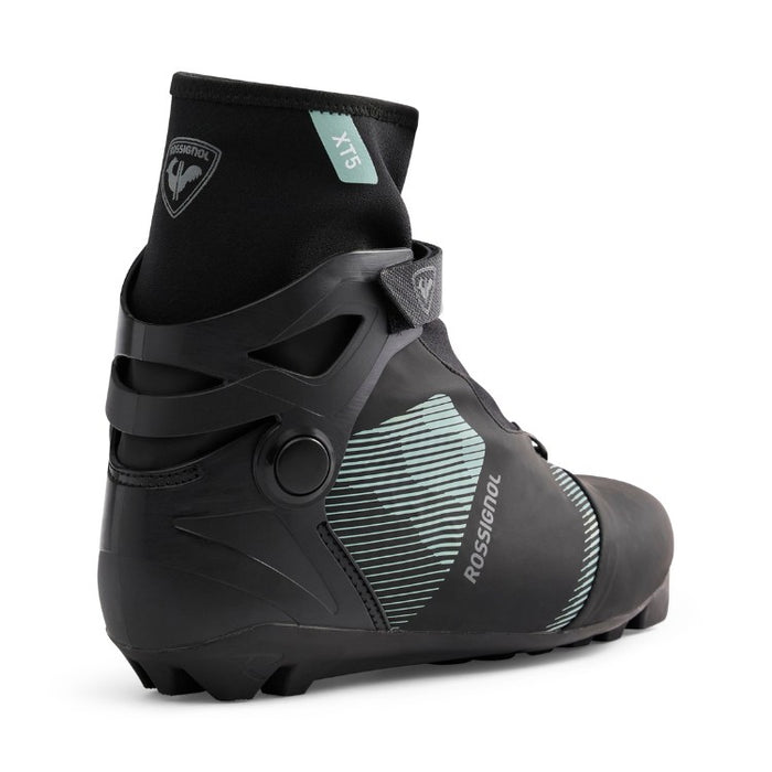 Black and gray ski boot with brand logo on a white background
