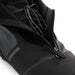 Close-up of a black ski boot with visible branding on a white background
