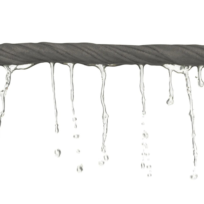 Grey towel twisted into a rope with water dripping out on a white background