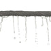 Grey towel twisted into a rope with water dripping out on a white background
