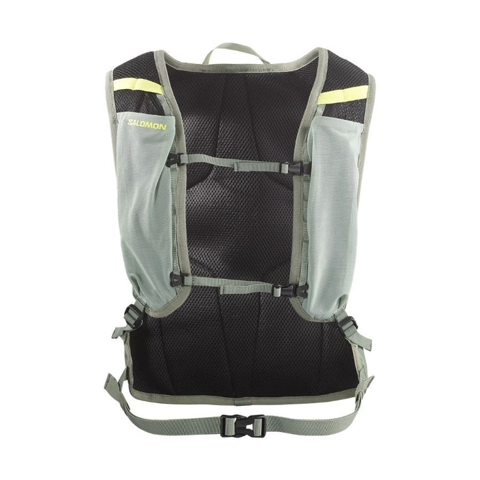 Black and light green running pack harness with Salomon branding against a white background