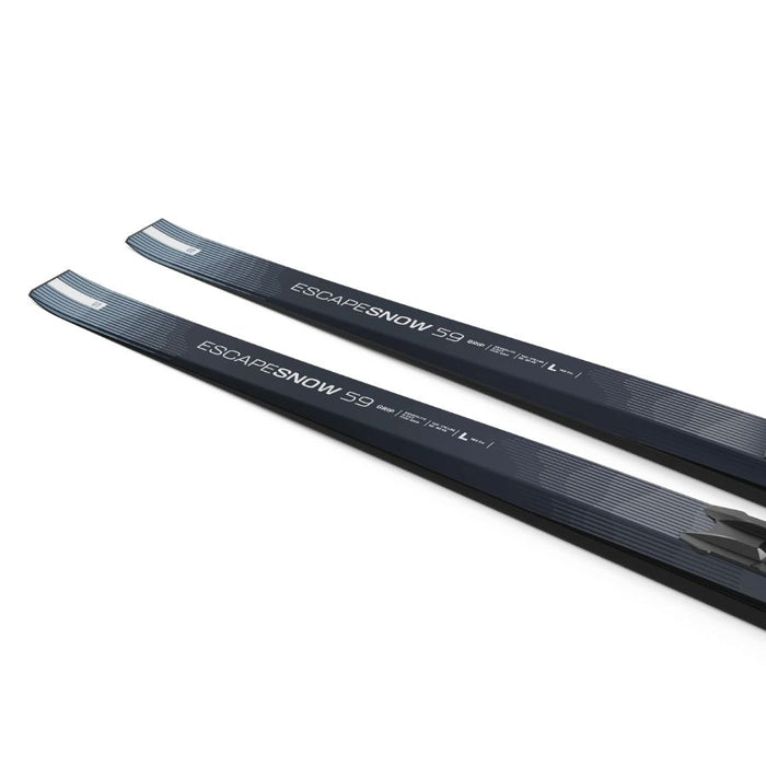 The tails of Light blue and black skis with Salomon branding against a white background.