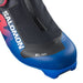 Close up of the toe of a blue and black ski boot with Salomon branding against a white background.