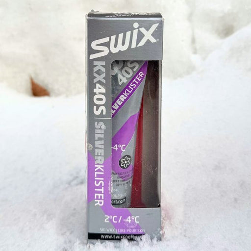 Swix KX40S Silver Klister packaging on a snowy background