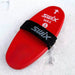 Red swix ski wax tool on a snowy background