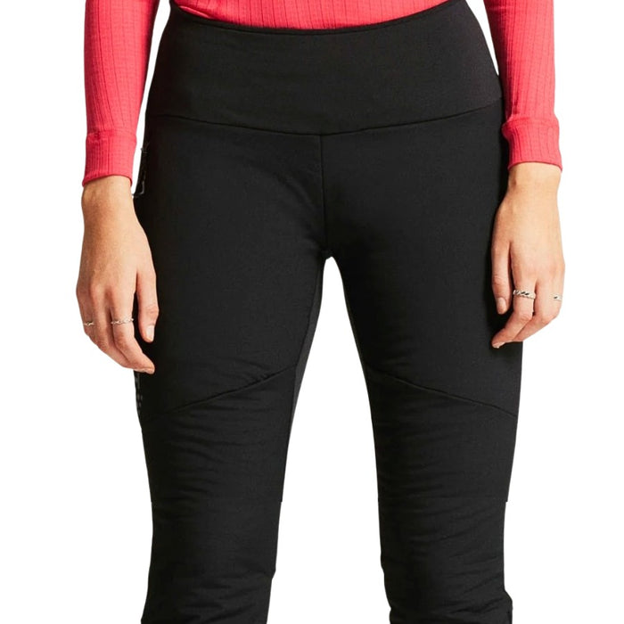 Person wearing black pants with a red top on a white background