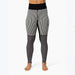 Black and white patterned leggings worn by a model, featuring vertical stripes on the upper legs and a black-and-white geometric pattern on the lower legs, shown against a plain white background.