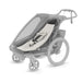 Gray and white stroller on a white background