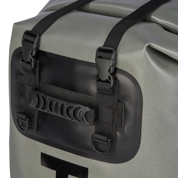 Close-up of a gray waterproof dry bag with black straps, plastic buckles, and a black plastic handle attachment panel.