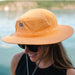 Woman wearing an Outdoor Research helios sun hat